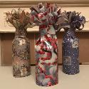 A photo of three giftwrapped bottles